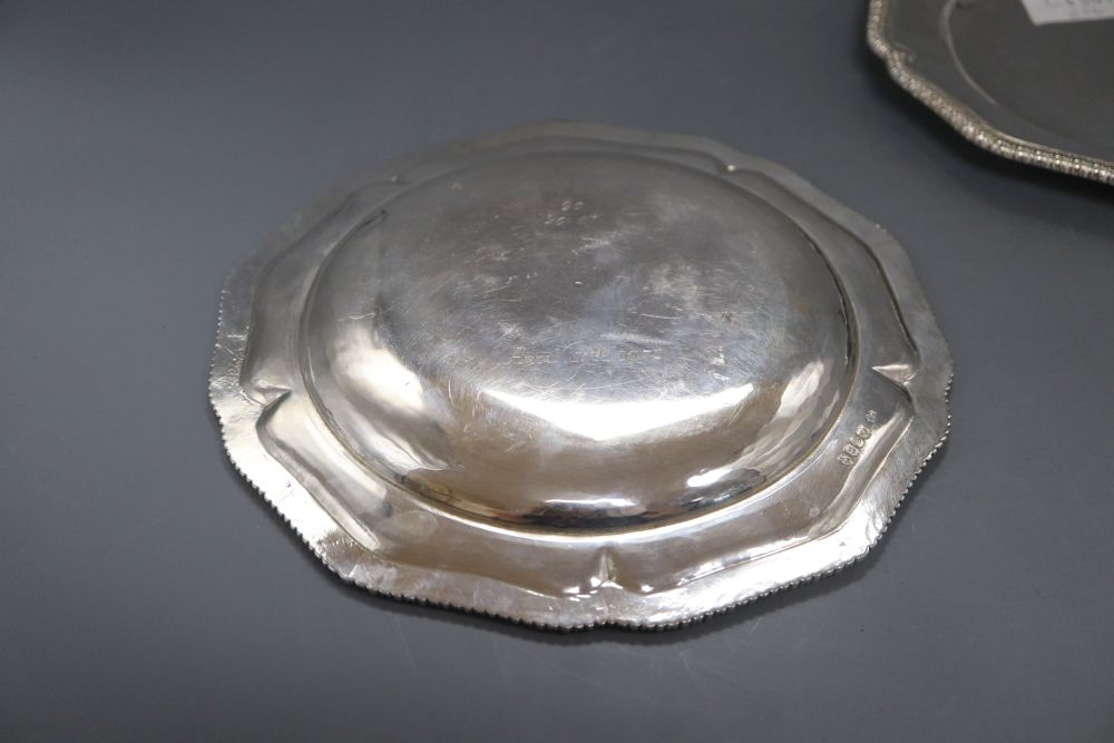 A pair of George IV silver shaped circular dinner plates, with gadrooned borders,